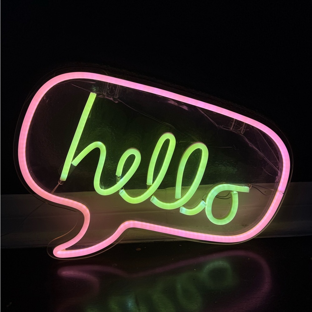 Neon Hello Sign with Pink and Green Lights